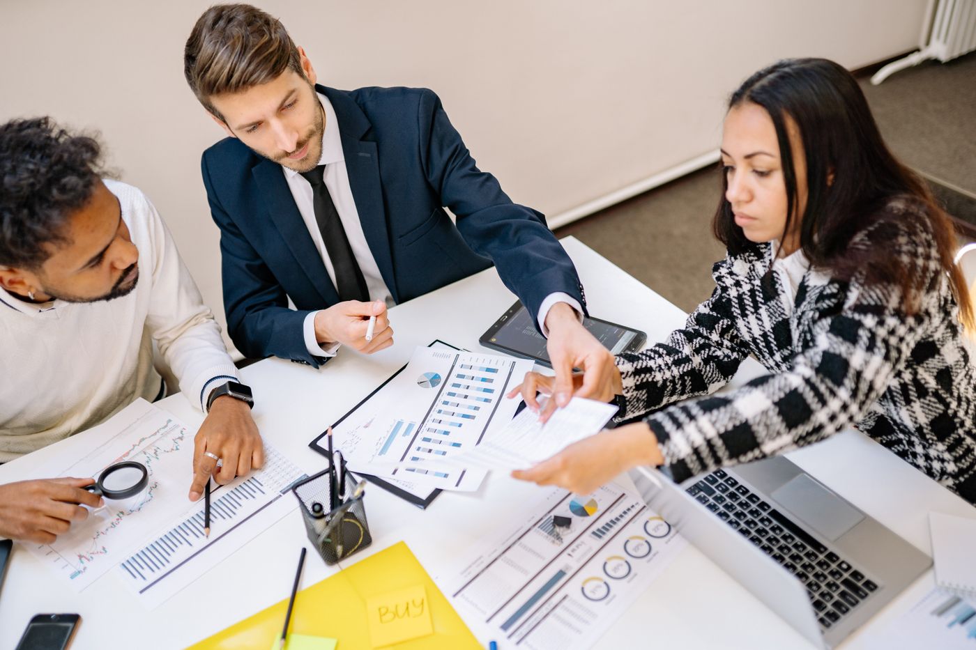 Team analyzing financial information during a work meeting